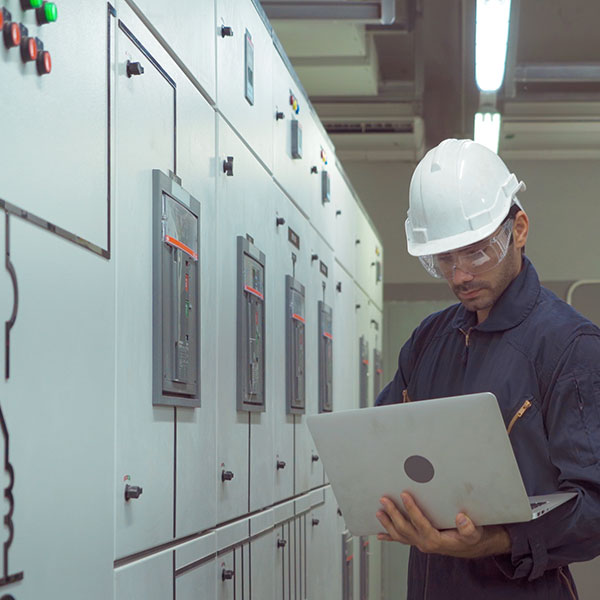 Man Smiling Outdoors in Coat