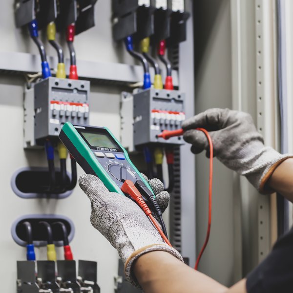 Young Woman Smiling By Green Wall